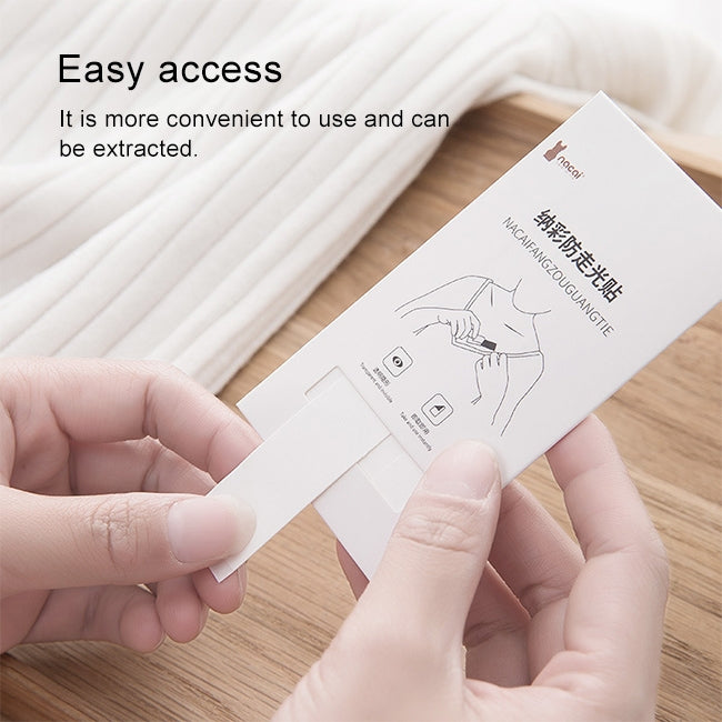 Hands pulling out a small transparent adhesive strip from a backing card