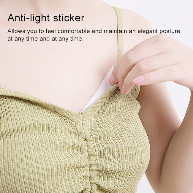 Invisible anti-slip adhesive strip holding a knit V-neck shoulder strap