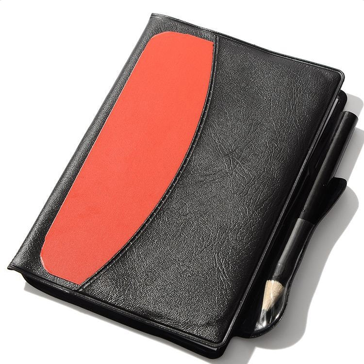 Black referee notebook with red card panel and attached pen/pencil
