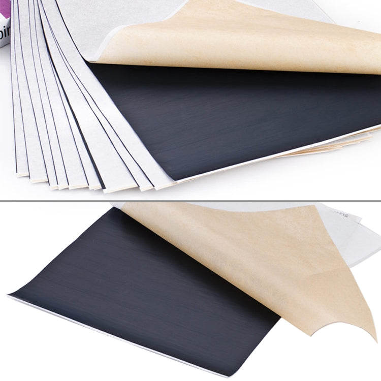 Tattoo transfer paper stack with tan top layer and dark transfer sheet