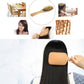 Wooden hair massage brush with black rubber base held against dark hair