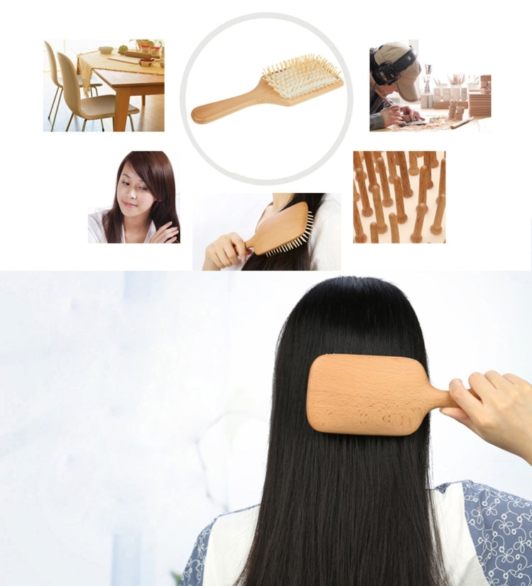 Wooden massage hair brush held to smooth dark hair