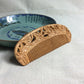 Wooden hair comb with carved floral border and evenly spaced straight teeth