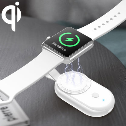 Magnetic wireless charger for Apple Watch on white strap with green charging icon