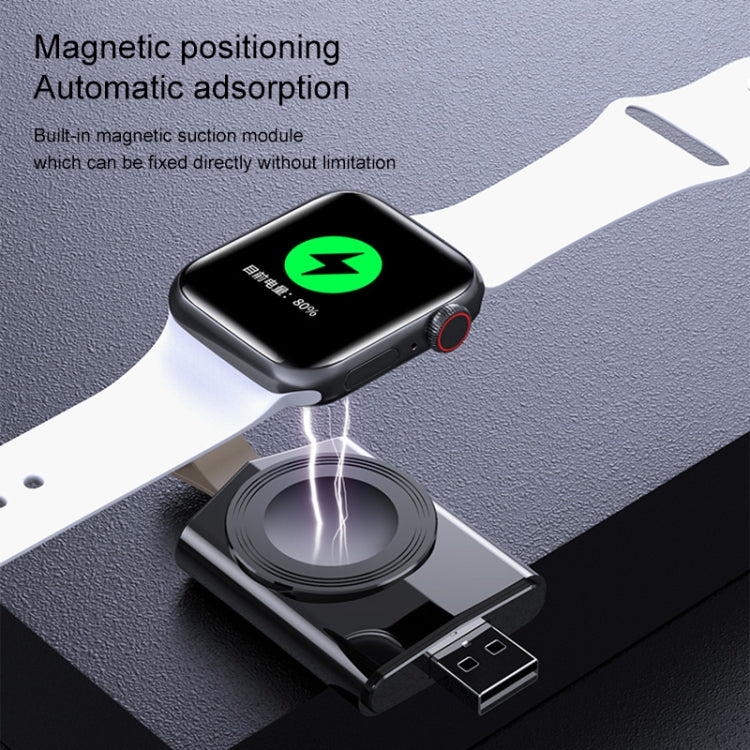 Black magnetic wireless charger dock with smartwatch positioned on pad