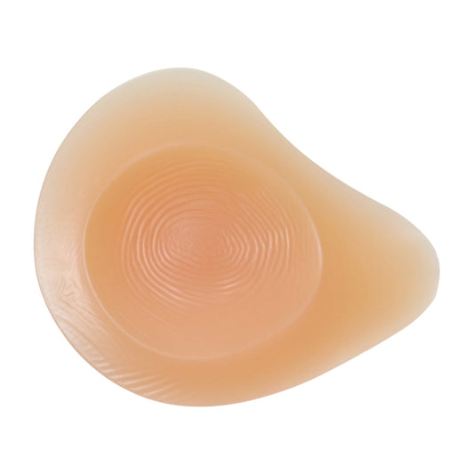Beige silicone postoperative breast pad for right side with textured concave backing.