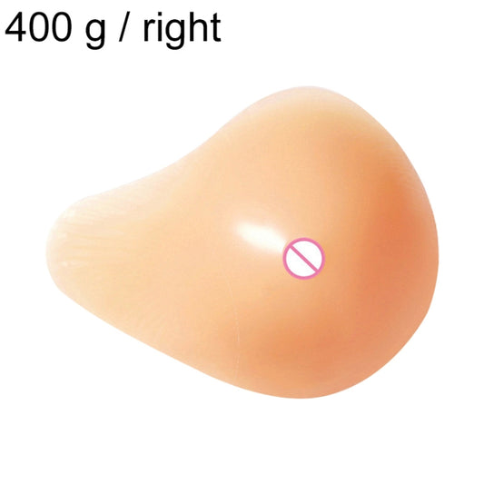 Right spiral-shape silicone breast pad, peach-toned, postoperative rehab