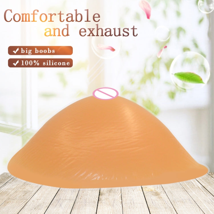 Silicone breast pad dome shape with nipple cover, peach skin tone.