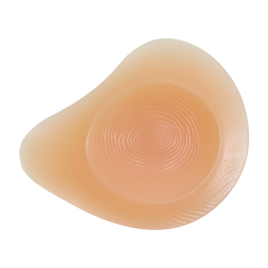 Left silicone breast pad, back side with raised spiral texture and nipple cover.