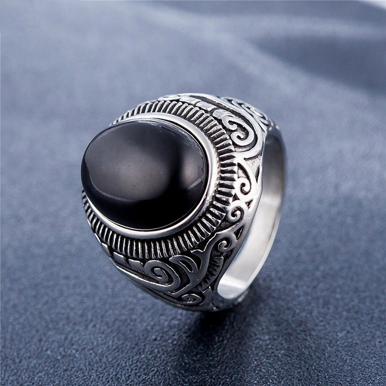 Men’s oval black-stone ring with ornate silver filigree band
