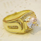 Gold-tone men’s ring with oval-shaped clear center zircon and channel-set accents