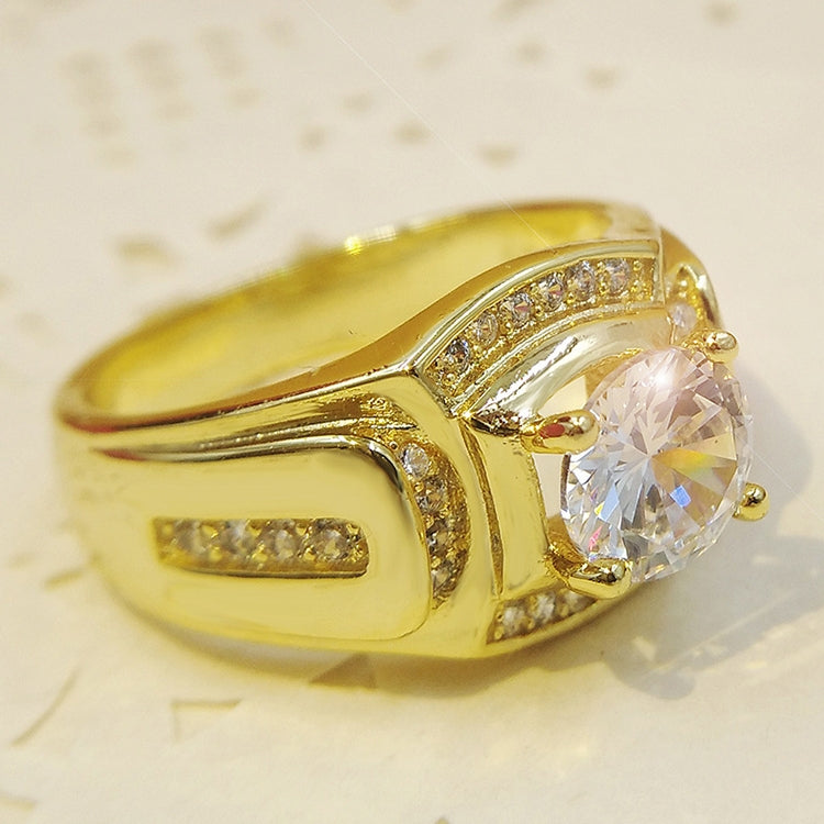 Gold-tone men’s ring with oval-shaped clear center zircon and channel-set accents