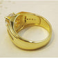 Gold-tone interior view of a men’s ring band with stamped markings