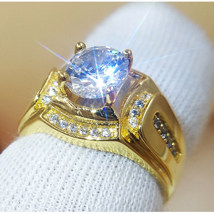 Men's ring with gold-tone band and large clear zircon centerpiece
