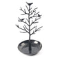Black tree jewelry organizer with bird figurines and round metal earring tray