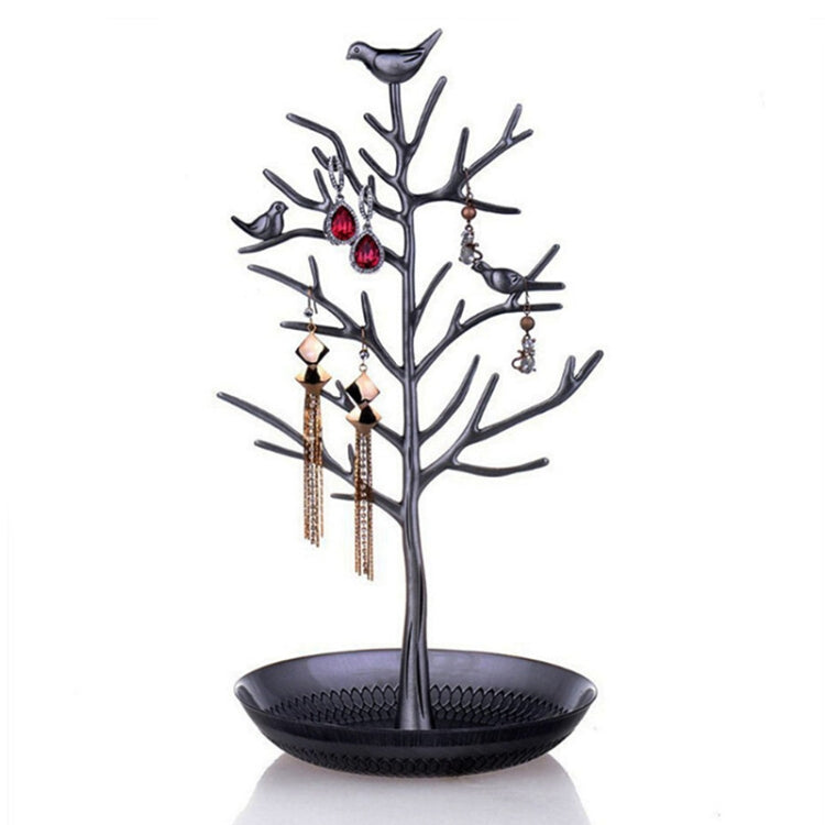 Black tree-shaped jewelry display with bird accents and round earring tray