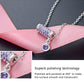 Silver chain necklace with purple crystal bar pendant and round purple drop charm