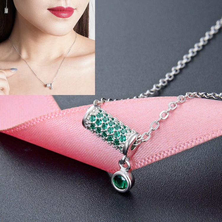 Silver chain necklace with rectangular green crystal bar pendant and round green drop charm