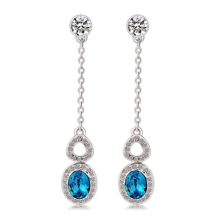 Silver-plated blue crystal drop earrings with clear stone accents and linked chains