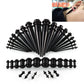 Black acrylic ear expansion gauge set with multiple sizes and matching black posts