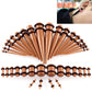 Brown acrylic ear expansion gauge set with black rims and straight insertion posts