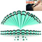 Mint green acrylic ear expansion gauge set with black rims and matching posts