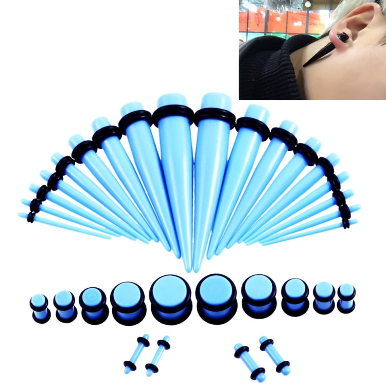 Acrylic ear expander set with light blue and black plugs and matching 14G–00G pieces