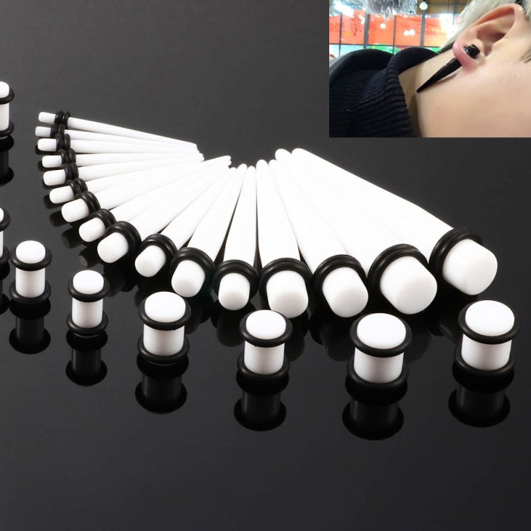Acrylic ear expander set with white plugs and black base, including 14G–00G stretchers