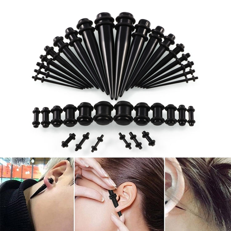 Acrylic ear expander set with black plugs and 14G–00G stretchers, shown on model