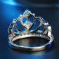 Crown-shaped zircon ring with heart motif top and small prong-set stones
