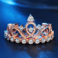 Rose gold crown ring with center round zircon and rows of side stones