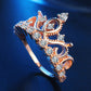 Rose gold crown zircon ring with round clear stones, angled close-up