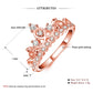 Rose gold crown-shaped zircon ring on white, illustrated profile view with clear stones