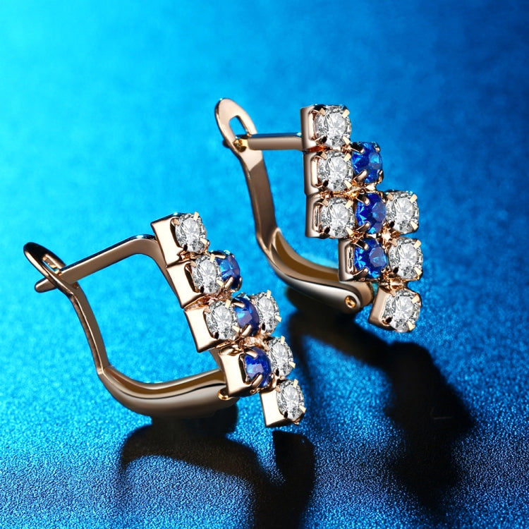 Rose gold-tone crystal cluster stud earrings with blue stones and hinged back