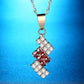 Gold-plated crystal pendant necklace with red and clear geometric drop on chain