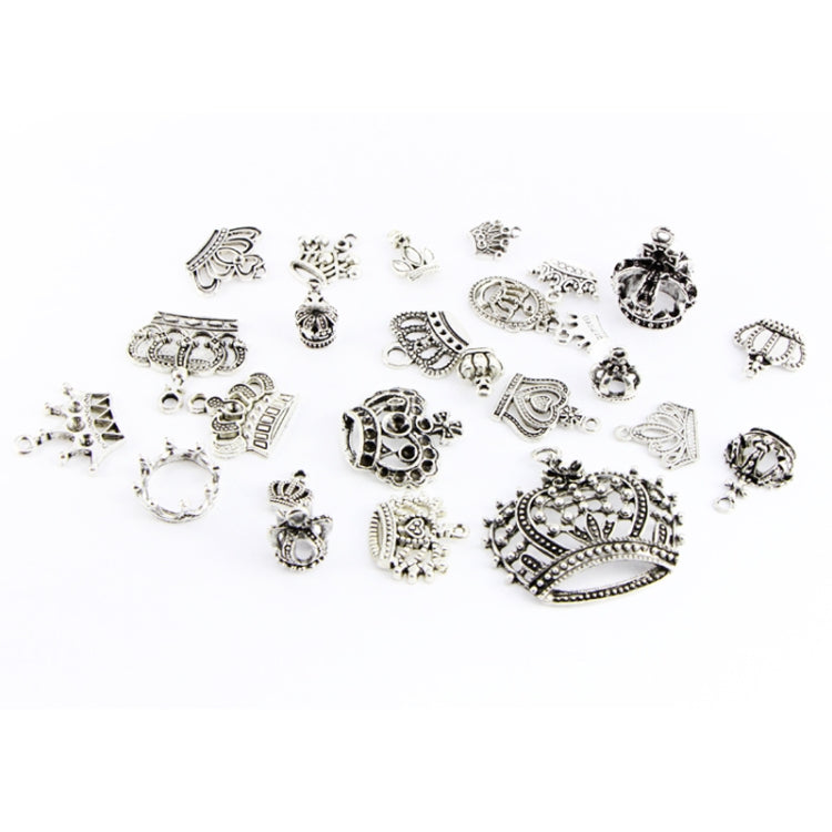 Assorted silver crown pendants with decorative details and small dangling charm loops