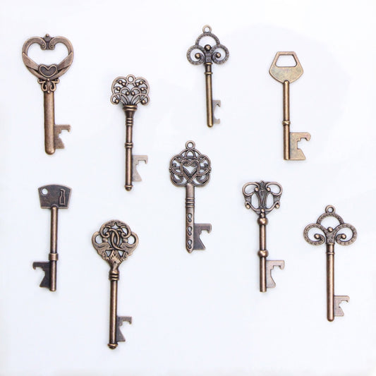 Antique bronze skeleton key set with ornate bow toppers, assorted sizes, for crafts or jewelry