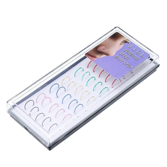Clear box containing multiple color nose circle rings in small hoop shapes