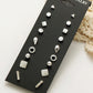 Silver-tone stud earring set with nine assorted geometric pieces on display card
