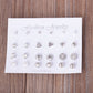 12-pair stud earring set on display card with silver round studs, crystals, and pearl-look beads