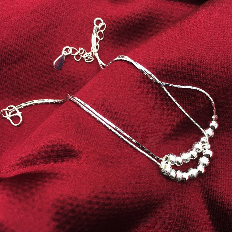 Silver-tone anklets with thin chains, frosted beads, and heart-shaped clasps