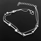 Silver-tone double anklet set with star and bead charms, chain and clasp