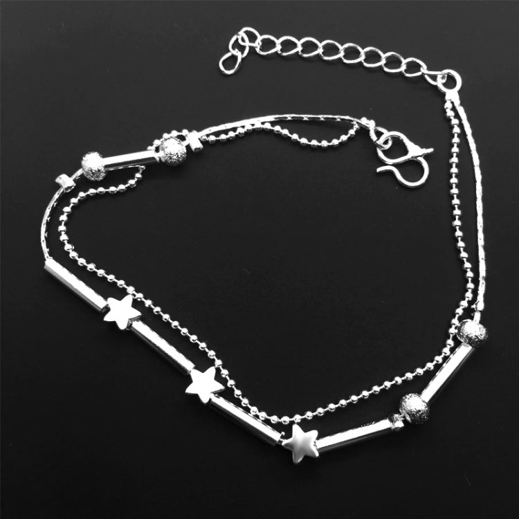 Silver-tone double anklet set with star and bead charms, chain and clasp