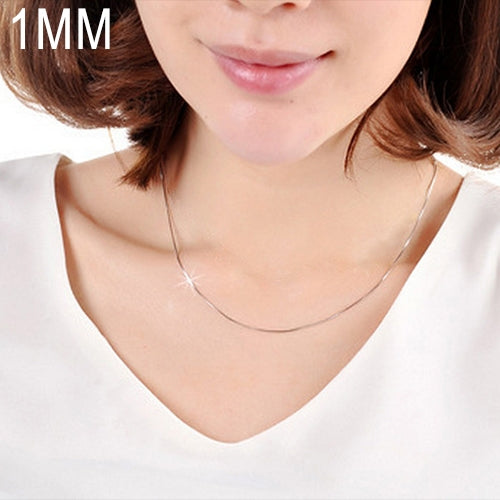 1mm silver plated snake bone chain necklace worn at the neckline