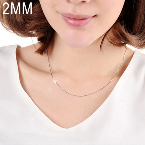 Silver snake-bone chain necklace worn on model’s neck with thin 2mm links