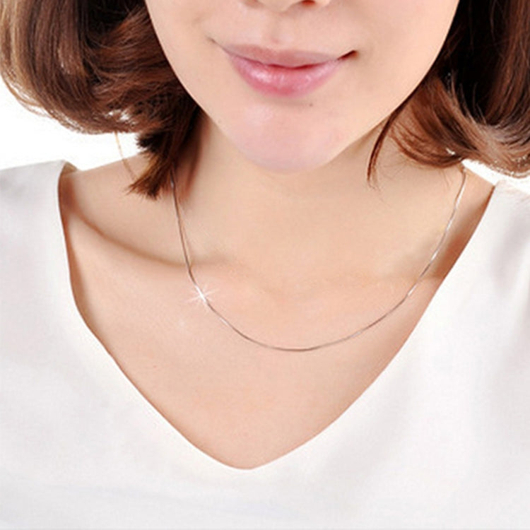 Silver snake-bone chain necklace on neckline, fine 2mm links