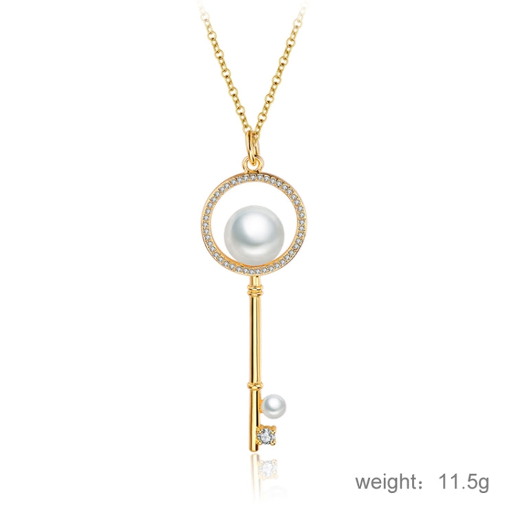Gold circular pearl key pendant necklace with rhinestone halo and slim key charm