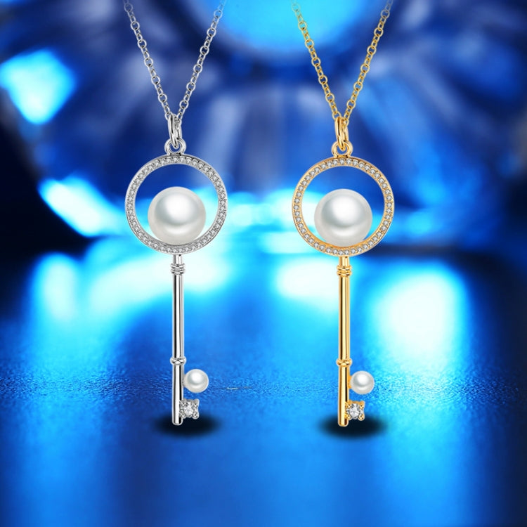 Pair key pendant necklaces: silver and gold round pearl charms with rhinestone halos