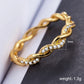 Gold twist eternity ring with marquise rhinestones, size 7