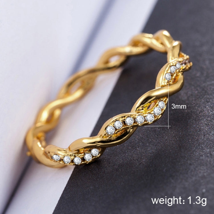 Gold twist style rhinestone ring with full stone bezel links, US size 8